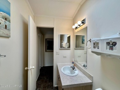 Nestled among the pines, this charming 2-bedroom, 2-bath home on Pine Shadows Golf Course in Arizona - for sale on GolfHomes.com, golf home, golf lot