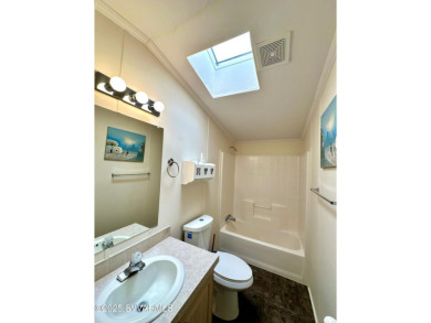 Nestled among the pines, this charming 2-bedroom, 2-bath home on Pine Shadows Golf Course in Arizona - for sale on GolfHomes.com, golf home, golf lot
