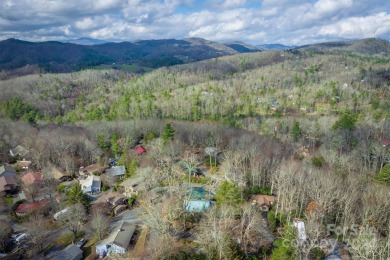 Nestled in the serene beauty of the North Carolina mountains on Land Harbor Golf Course in North Carolina - for sale on GolfHomes.com, golf home, golf lot