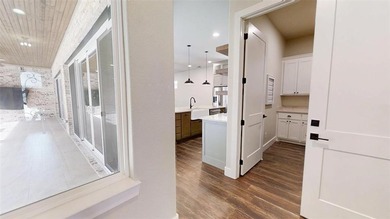 Experience luxury living in the gated enclave of freestanding on Harbor Lakes Golf Club in Texas - for sale on GolfHomes.com, golf home, golf lot