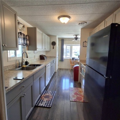 Light, Bright & Full of Possibilities in Barefoot Bay! Step into on Barefoot Bay Golf Course in Florida - for sale on GolfHomes.com, golf home, golf lot