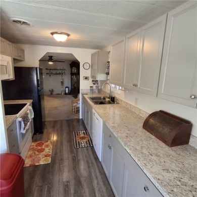Light, Bright & Full of Possibilities in Barefoot Bay! Step into on Barefoot Bay Golf Course in Florida - for sale on GolfHomes.com, golf home, golf lot