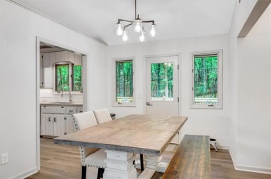 Perched above the shoreline on nearly half an acre, this turnkey on The Highlands Course at Lake Arrowhead in Georgia - for sale on GolfHomes.com, golf home, golf lot