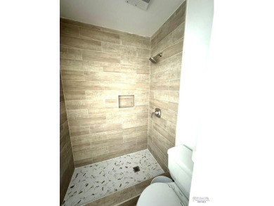 Welcome to this completely remodeled 4-bedroom, 4-bath home in on Rancho Viejo Resort and Country Club in Texas - for sale on GolfHomes.com, golf home, golf lot