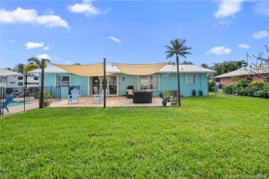 Remarkable Opportunity! Discover this Remodeled Concrete Block on Miles Grant Country Club in Florida - for sale on GolfHomes.com, golf home, golf lot