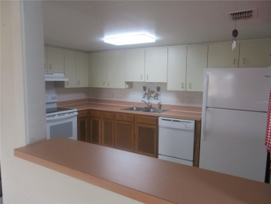 AFFORDBLE GROUND FLOOR 2/2 CONDOMINIUM JUST 500 FEET AWAY FROM on Country Club At Silver Springs Shores in Florida - for sale on GolfHomes.com, golf home, golf lot