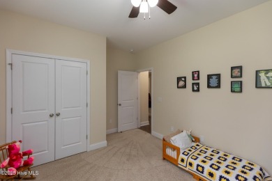 Welcome to this beautiful custom-built 4-bedroom, 3.5-bath home on Whispering Woods in North Carolina - for sale on GolfHomes.com, golf home, golf lot