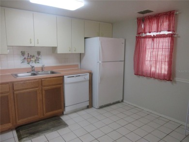 AFFORDBLE GROUND FLOOR 2/2 CONDOMINIUM JUST 500 FEET AWAY FROM on Country Club At Silver Springs Shores in Florida - for sale on GolfHomes.com, golf home, golf lot