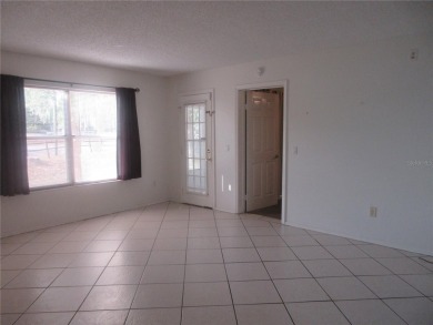 AFFORDBLE GROUND FLOOR 2/2 CONDOMINIUM JUST 500 FEET AWAY FROM on Country Club At Silver Springs Shores in Florida - for sale on GolfHomes.com, golf home, golf lot