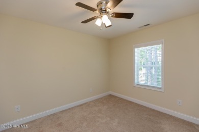 Welcome to this beautiful custom-built 4-bedroom, 3.5-bath home on Whispering Woods in North Carolina - for sale on GolfHomes.com, golf home, golf lot
