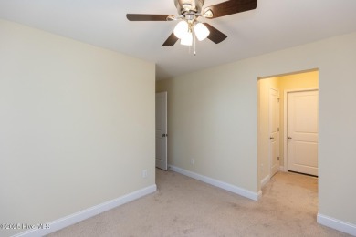 Welcome to this beautiful custom-built 4-bedroom, 3.5-bath home on Whispering Woods in North Carolina - for sale on GolfHomes.com, golf home, golf lot