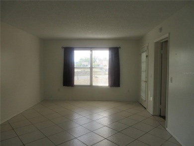 AFFORDBLE GROUND FLOOR 2/2 CONDOMINIUM JUST 500 FEET AWAY FROM on Country Club At Silver Springs Shores in Florida - for sale on GolfHomes.com, golf home, golf lot