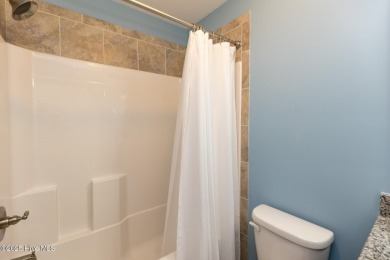 Welcome to this beautiful custom-built 4-bedroom, 3.5-bath home on Whispering Woods in North Carolina - for sale on GolfHomes.com, golf home, golf lot