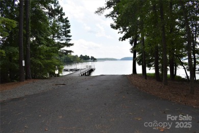 This premium Badin Lake water view lot is located in the on Old North State Club at Uwharrie Point Golf community in North Carolina - for sale on GolfHomes.com, golf home, golf lot