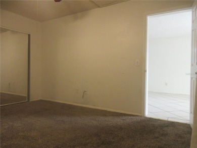 AFFORDBLE GROUND FLOOR 2/2 CONDOMINIUM JUST 500 FEET AWAY FROM on Country Club At Silver Springs Shores in Florida - for sale on GolfHomes.com, golf home, golf lot