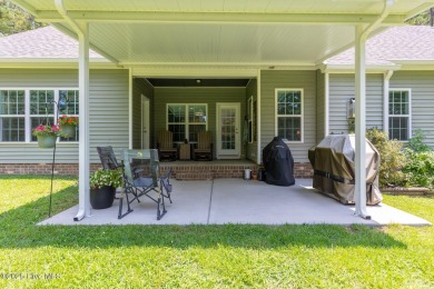 Welcome to this beautiful custom-built 4-bedroom, 3.5-bath home on Whispering Woods in North Carolina - for sale on GolfHomes.com, golf home, golf lot
