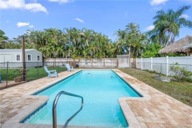 Remarkable Opportunity! Discover this Remodeled Concrete Block on Miles Grant Country Club in Florida - for sale on GolfHomes.com, golf home, golf lot