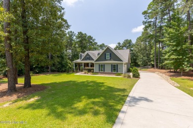 Welcome to this beautiful custom-built 4-bedroom, 3.5-bath home on Whispering Woods in North Carolina - for sale on GolfHomes.com, golf home, golf lot