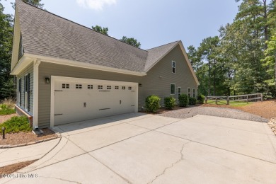 Welcome to this beautiful custom-built 4-bedroom, 3.5-bath home on Whispering Woods in North Carolina - for sale on GolfHomes.com, golf home, golf lot
