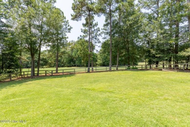 Welcome to this beautiful custom-built 4-bedroom, 3.5-bath home on Whispering Woods in North Carolina - for sale on GolfHomes.com, golf home, golf lot