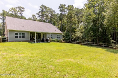 Welcome to this beautiful custom-built 4-bedroom, 3.5-bath home on Whispering Woods in North Carolina - for sale on GolfHomes.com, golf home, golf lot