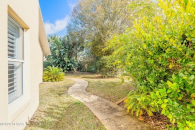 Welcome to this exceptional 3-bedroom, 2-bathroom home located on Spruce Creek Golf Club in Florida - for sale on GolfHomes.com, golf home, golf lot