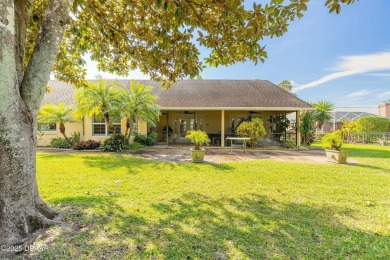 Welcome to this exceptional 3-bedroom, 2-bathroom home located on Spruce Creek Golf Club in Florida - for sale on GolfHomes.com, golf home, golf lot