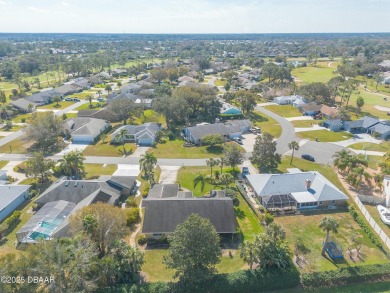 Welcome to this exceptional 3-bedroom, 2-bathroom home located on Spruce Creek Golf Club in Florida - for sale on GolfHomes.com, golf home, golf lot