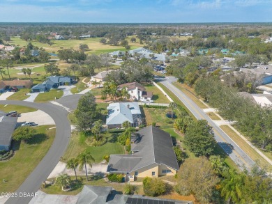 Welcome to this exceptional 3-bedroom, 2-bathroom home located on Spruce Creek Golf Club in Florida - for sale on GolfHomes.com, golf home, golf lot