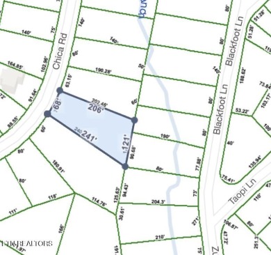 Discover a beautiful slopped  wooded lot; perfect for a walk out on Lake Tansi Village Country Club in Tennessee - for sale on GolfHomes.com, golf home, golf lot
