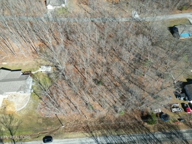 Discover a beautiful gently slopped  wooded lot on a tarred and on Lake Tansi Village Country Club in Tennessee - for sale on GolfHomes.com, golf home, golf lot