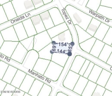 Discover a beautiful wooded level lot on a paved road in Lake on Lake Tansi Village Country Club in Tennessee - for sale on GolfHomes.com, golf home, golf lot