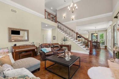 Nestled alongside the greens of the Pascagoula Country Club golf on Pascagoula Country Club in Mississippi - for sale on GolfHomes.com, golf home, golf lot