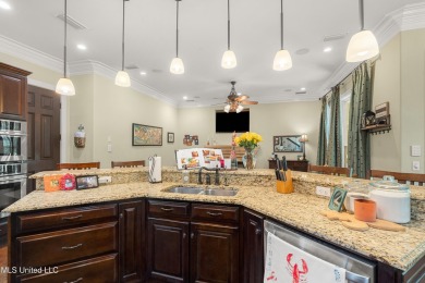 Nestled alongside the greens of the Pascagoula Country Club golf on Pascagoula Country Club in Mississippi - for sale on GolfHomes.com, golf home, golf lot