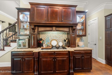 Nestled alongside the greens of the Pascagoula Country Club golf on Pascagoula Country Club in Mississippi - for sale on GolfHomes.com, golf home, golf lot