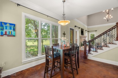 Nestled alongside the greens of the Pascagoula Country Club golf on Pascagoula Country Club in Mississippi - for sale on GolfHomes.com, golf home, golf lot