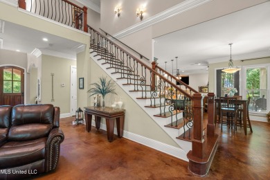 Nestled alongside the greens of the Pascagoula Country Club golf on Pascagoula Country Club in Mississippi - for sale on GolfHomes.com, golf home, golf lot