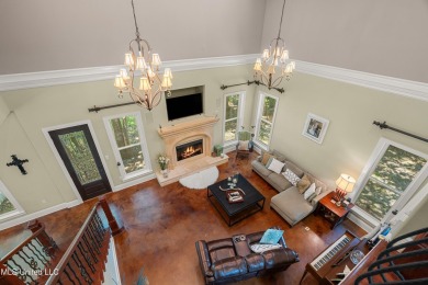 Nestled alongside the greens of the Pascagoula Country Club golf on Pascagoula Country Club in Mississippi - for sale on GolfHomes.com, golf home, golf lot