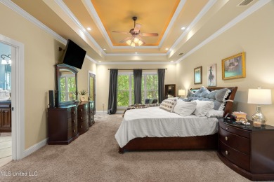 Nestled alongside the greens of the Pascagoula Country Club golf on Pascagoula Country Club in Mississippi - for sale on GolfHomes.com, golf home, golf lot