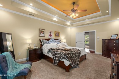 Nestled alongside the greens of the Pascagoula Country Club golf on Pascagoula Country Club in Mississippi - for sale on GolfHomes.com, golf home, golf lot