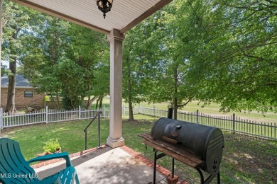 Nestled alongside the greens of the Pascagoula Country Club golf on Pascagoula Country Club in Mississippi - for sale on GolfHomes.com, golf home, golf lot