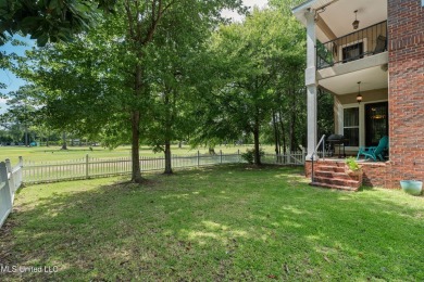 Nestled alongside the greens of the Pascagoula Country Club golf on Pascagoula Country Club in Mississippi - for sale on GolfHomes.com, golf home, golf lot