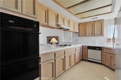 SUPER CUTE 3 BR ACROSS FROM THE NORTH LAKE!! ROOM FOR A POOL! on Silver Lakes Golf Course in California - for sale on GolfHomes.com, golf home, golf lot