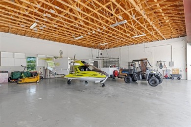 Experience the ultimate blend of luxury & aviation lifestyle in on The Wanderers Club in Florida - for sale on GolfHomes.com, golf home, golf lot