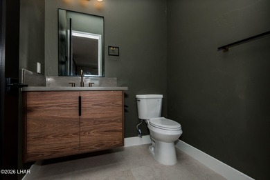 Experience modern luxury and energy-efficient living in this on Los Lagos Golf Club in Arizona - for sale on GolfHomes.com, golf home, golf lot