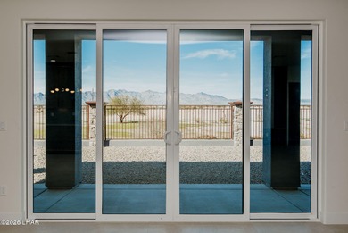 Experience modern luxury and energy-efficient living in this on Los Lagos Golf Club in Arizona - for sale on GolfHomes.com, golf home, golf lot