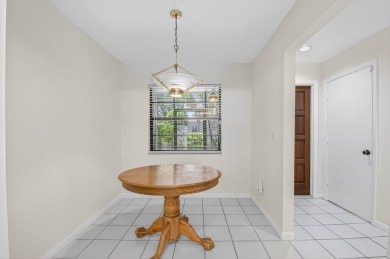 Nestled within a gated community, this 3 bedroom 2.5 bath on Boca Delray Golf and Country Club in Florida - for sale on GolfHomes.com, golf home, golf lot