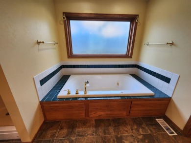 Don't miss this beautifully updated home in the highly on Dakota Dunes Country Club in South Dakota - for sale on GolfHomes.com, golf home, golf lot