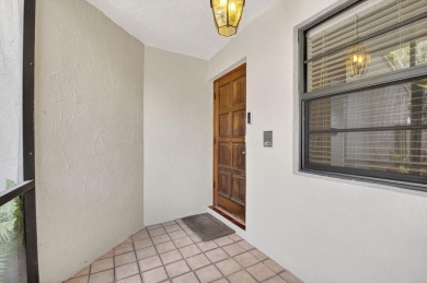 Nestled within a gated community, this 3 bedroom 2.5 bath on Boca Delray Golf and Country Club in Florida - for sale on GolfHomes.com, golf home, golf lot