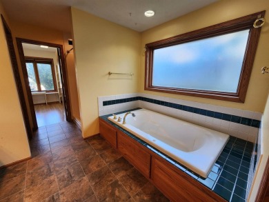 Don't miss this beautifully updated home in the highly on Dakota Dunes Country Club in South Dakota - for sale on GolfHomes.com, golf home, golf lot